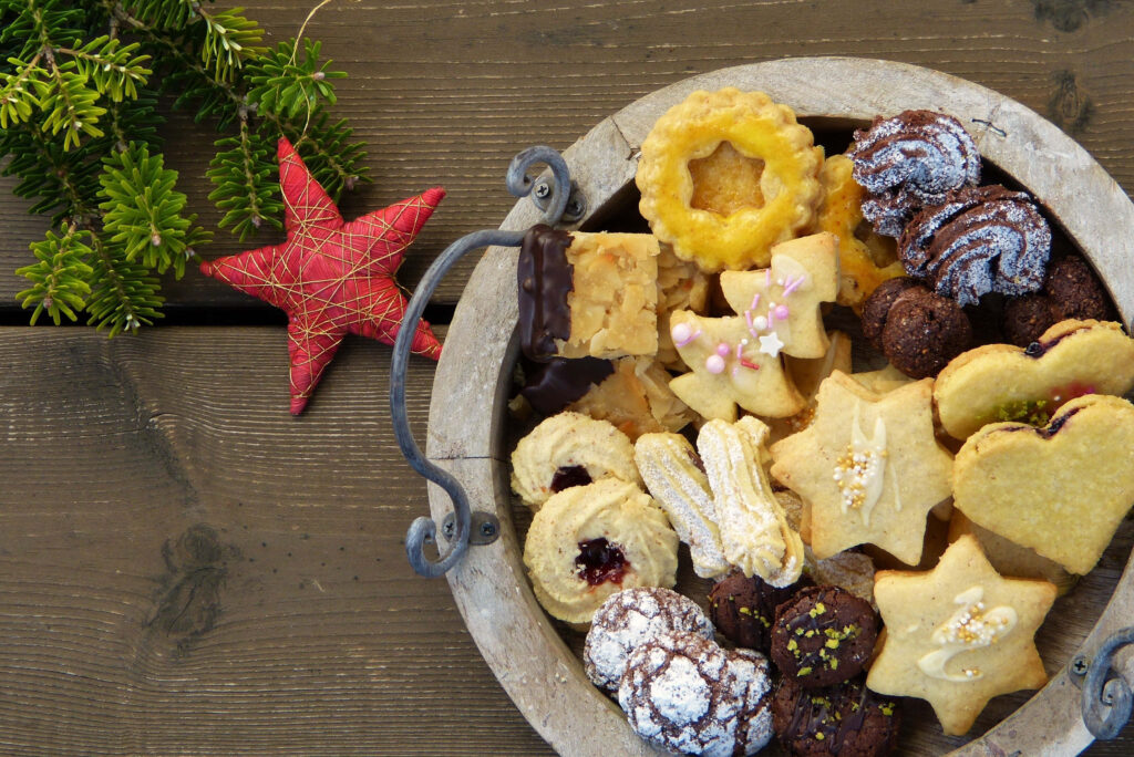 Festive Christmas Cookies on Rustic Table - Holiday Wallpaper Background