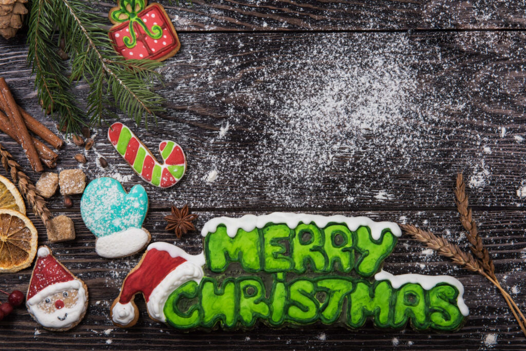 Cozy Christmas Cookies Wallpaper on Rustic Wooden Background