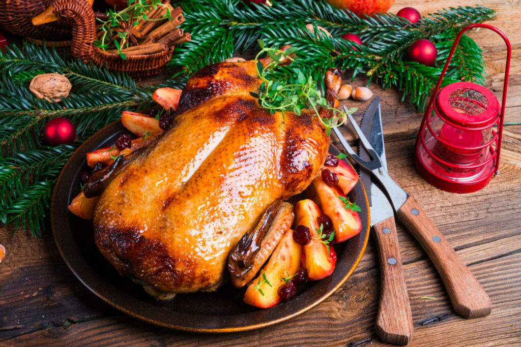 Festive Christmas Dinner Table with Roasted Turkey & Rustic Decor Wallpaper