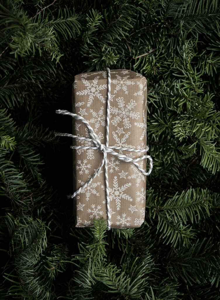 Festive Christmas Gift Wallpaper: Brown Paper & Snowflakes Background