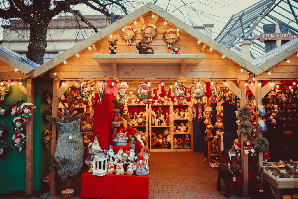 Festive Christmas Market Stall Wallpaper with Colorful Decorations