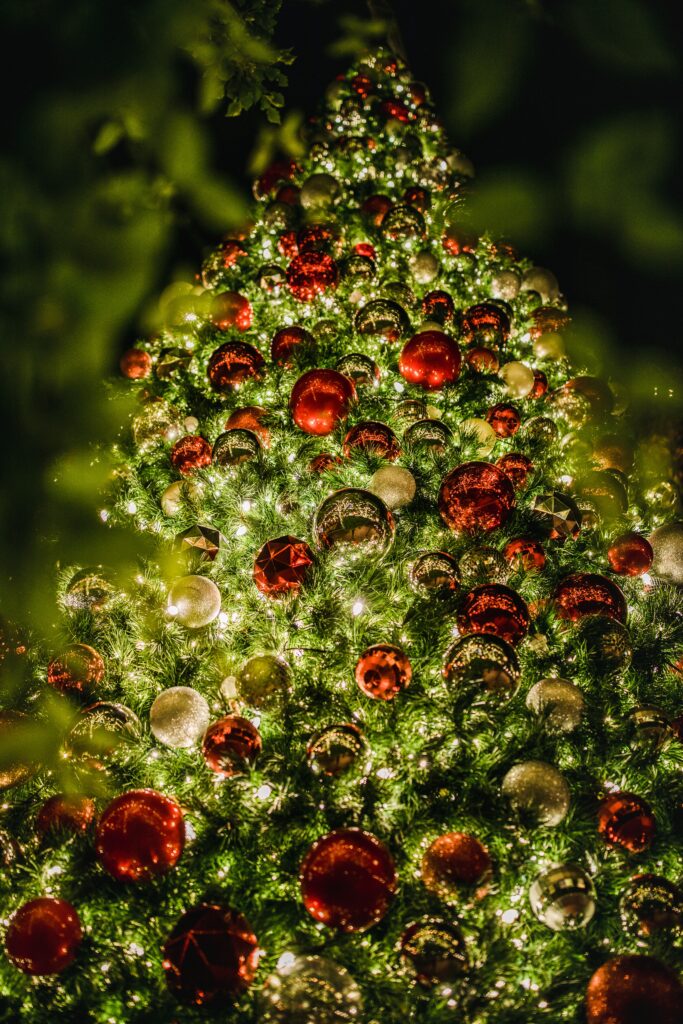 Festive Christmas Tree with Lights & Ornaments for Holiday Cheer Wallpaper