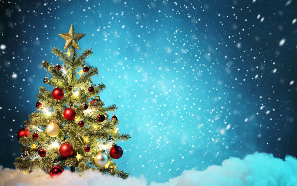 Elegant Christmas Tree in Snowfall with Gold & Red Ornaments Wallpaper