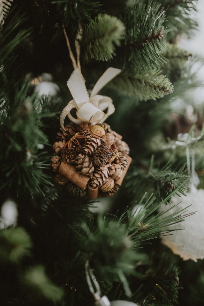 Rustic Christmas Tree with Pine Cones: Perfect Holiday Decor Wallpaper