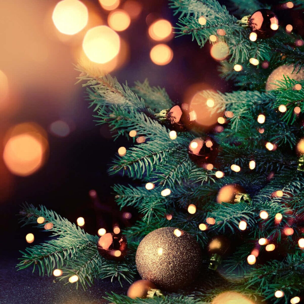 Festive Christmas Tree Wallpaper: Sparkling Ornaments & Glowing Lights