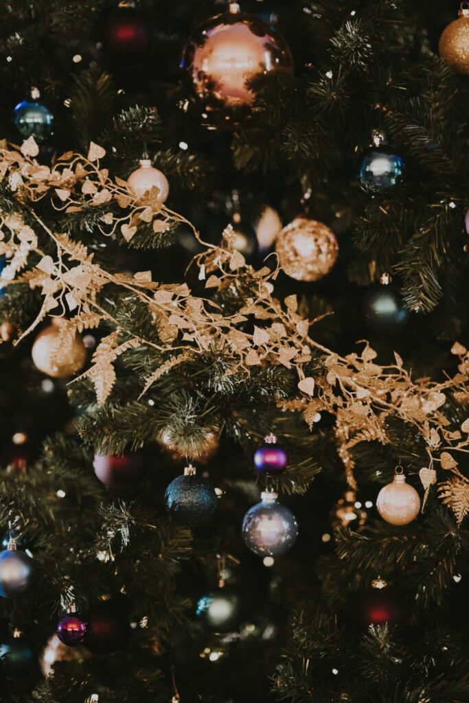 Festive Christmas Tree Wallpaper: Colorful Ornaments & Golden Garlands