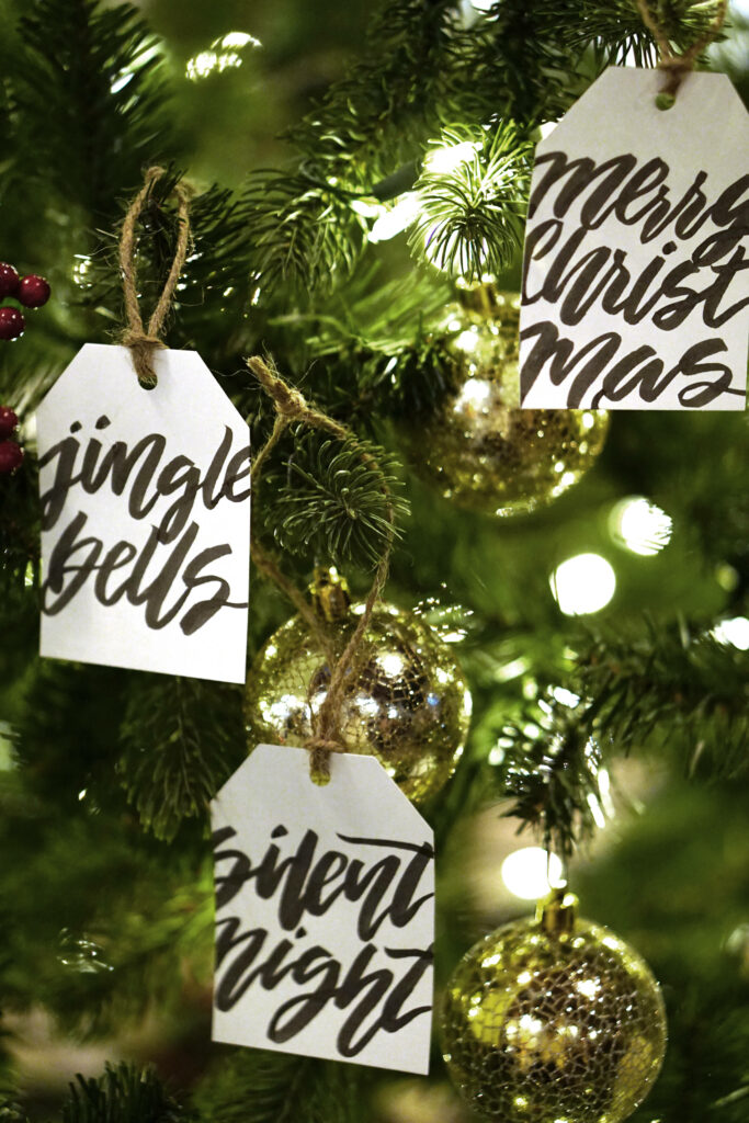 Charming Christmas Wallpaper with Tree, Gold Baubles & Joyful Phrases