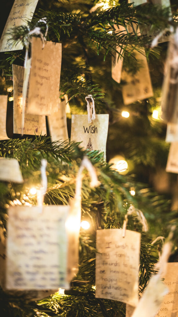Cozy Christmas Tree Wallpaper with Holiday Cards & Warm Lights