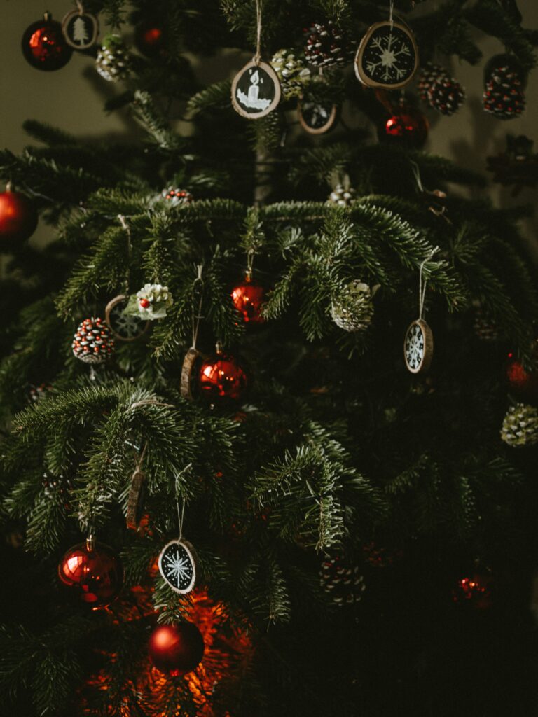 Festive Christmas Tree Wallpaper: Red & White Ornaments Background
