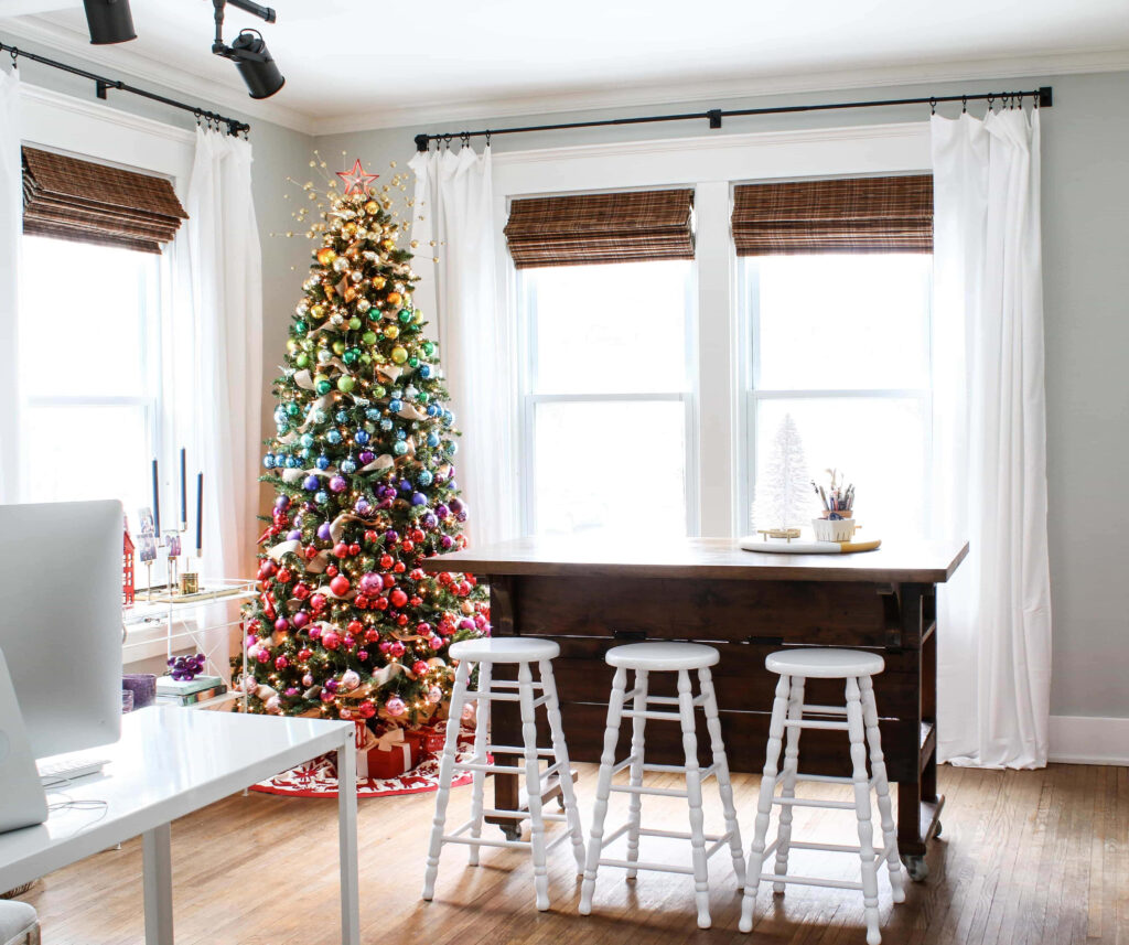 Festive Christmas Tree Brightens Cozy Home Office for the Holidays Wallpaper