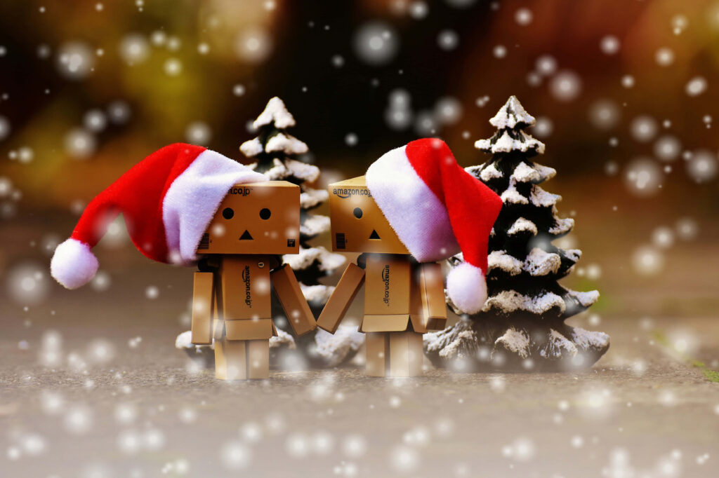 Festive Cardboard Figures in Santa Hats | Cute Snowy Christmas Wallpaper