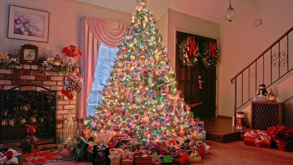 Festive Christmas Tree Wallpaper with Colorful Lights & Gifts