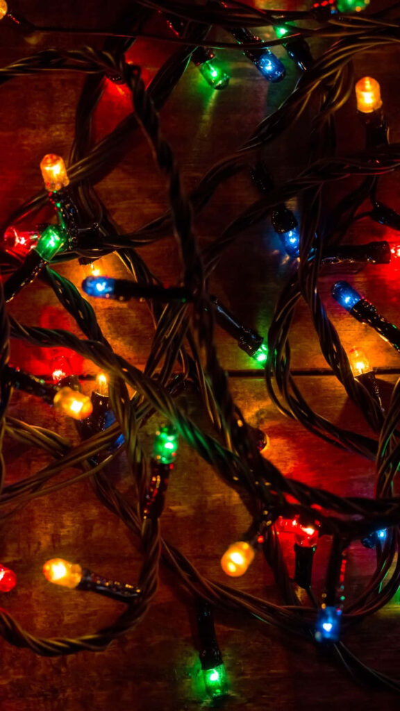 Festive Christmas Wallpaper: Colorful String Lights for Your Phone