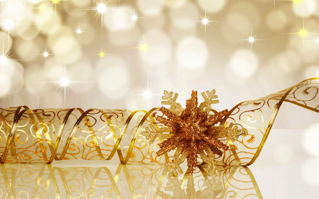 Festive Christmas Wallpaper: Gold Ribbon & Sparkling Snowflake Design