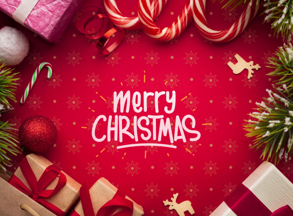 Vibrant Christmas Wallpaper: Red Background with Joyful Festive Decor