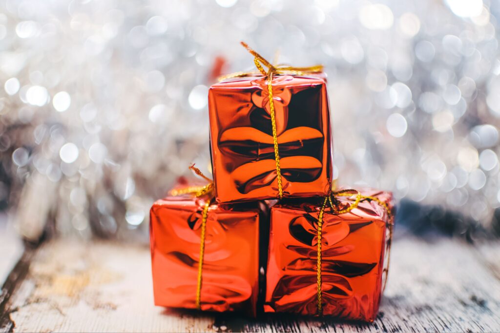 Festive Christmas Wallpaper: Red Gift Boxes & Sparkling Background