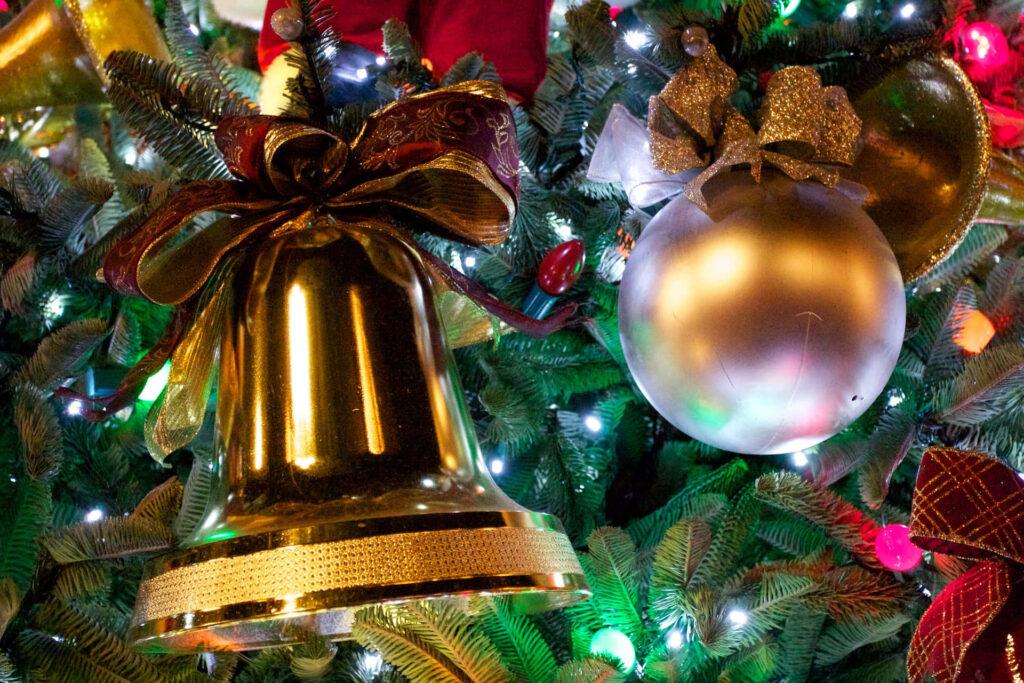 Festive Wallpaper: Shimmering Golden Bell & Colorful Christmas Decor