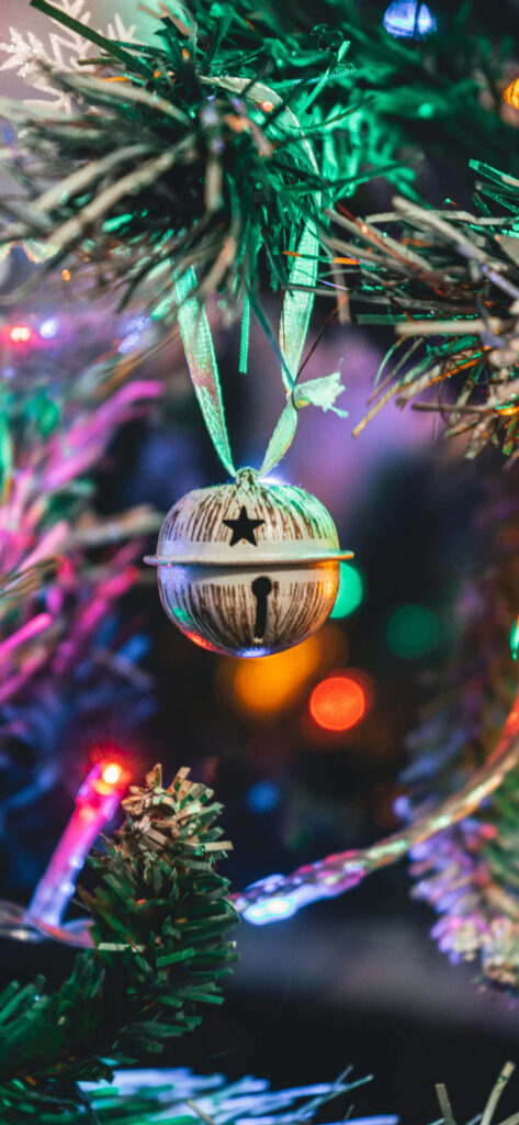 Cozy Christmas Wallpaper: Silver Bell & Colorful Lights Decor