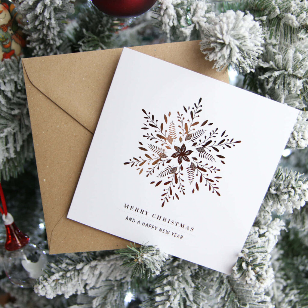 Festive Christmas Card Wallpaper with Snowflakes & Pine Tree Backdrop