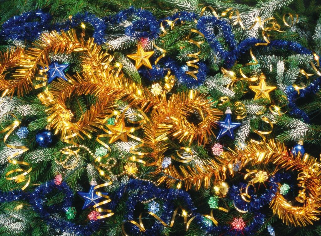 Joyous Christmas Tree Needle Wallpaper with Sparkling Decorations