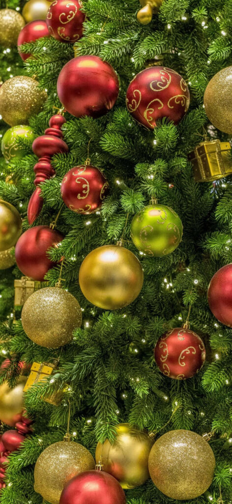 Festive Christmas iPhone Wallpaper: Decorated Tree & Evergreen Background