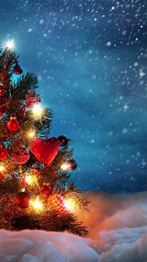 Festive Christmas iPhone Wallpaper: Decorated Tree & Snowy Background