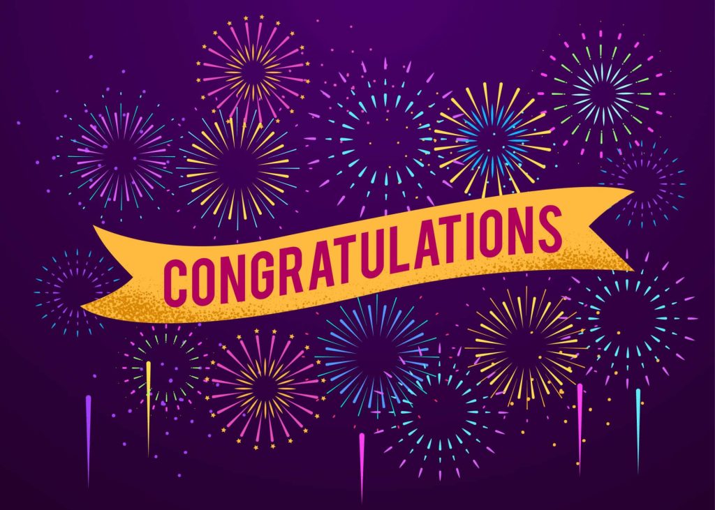 Festive congratulations banner with colorful fireworks on deep purple celebratory background Wallpaper