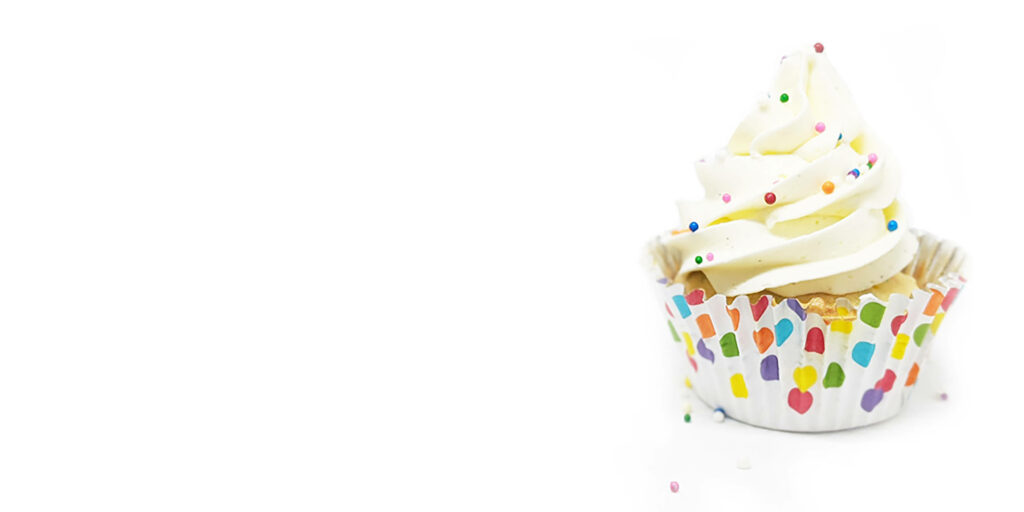 Festive Cupcake Wallpaper with Creamy Frosting & Colorful Sprinkles