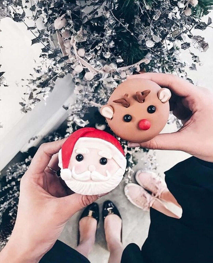 Whimsical Holiday Cupcakes with Santa & Reindeer by a Snowy Tree Wallpaper