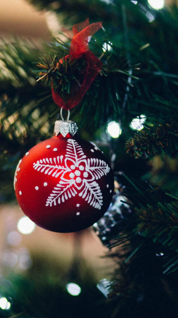 Festive Charm: Ornate Red Ball Christmas Decor in Selective Focus - Tree Branch Holiday Wallpaper