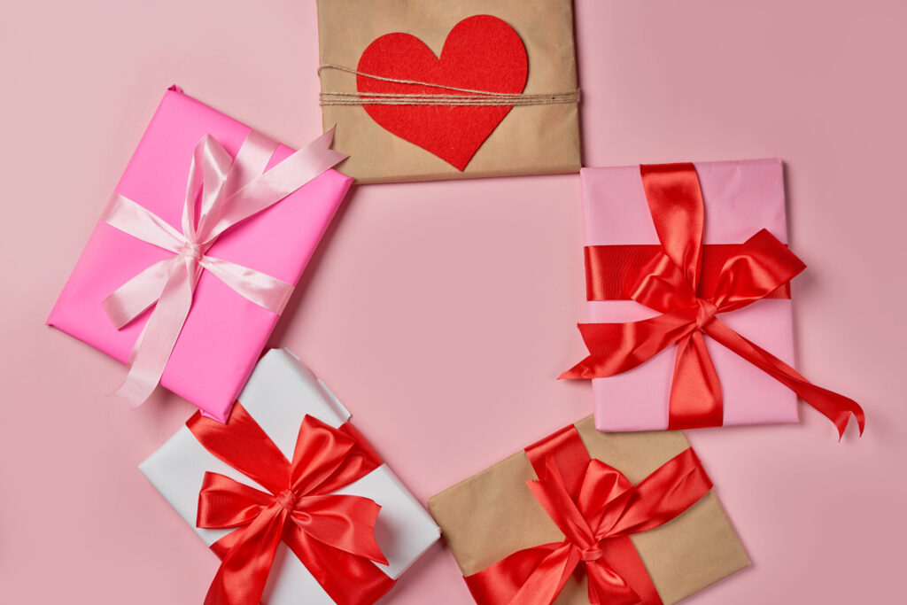 Festive Gift Boxes with Pink & Red Ribbons - Heartwarming Wallpaper