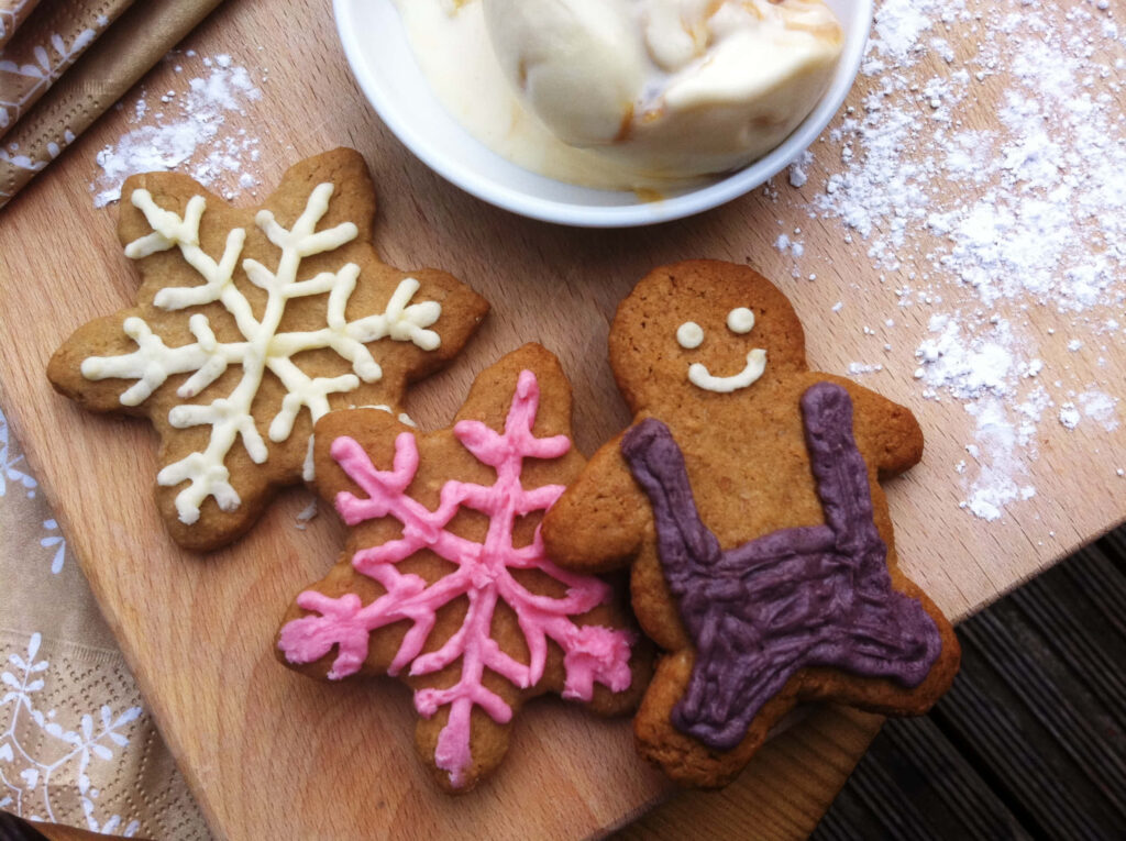 Cheerful Gingerbread Cookies Wallpaper for Holiday Spirit Background