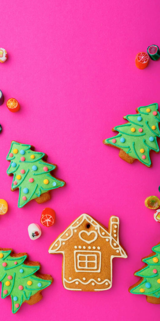 Festive Gingerbread Cookies & Christmas Trees Wallpaper on Pink