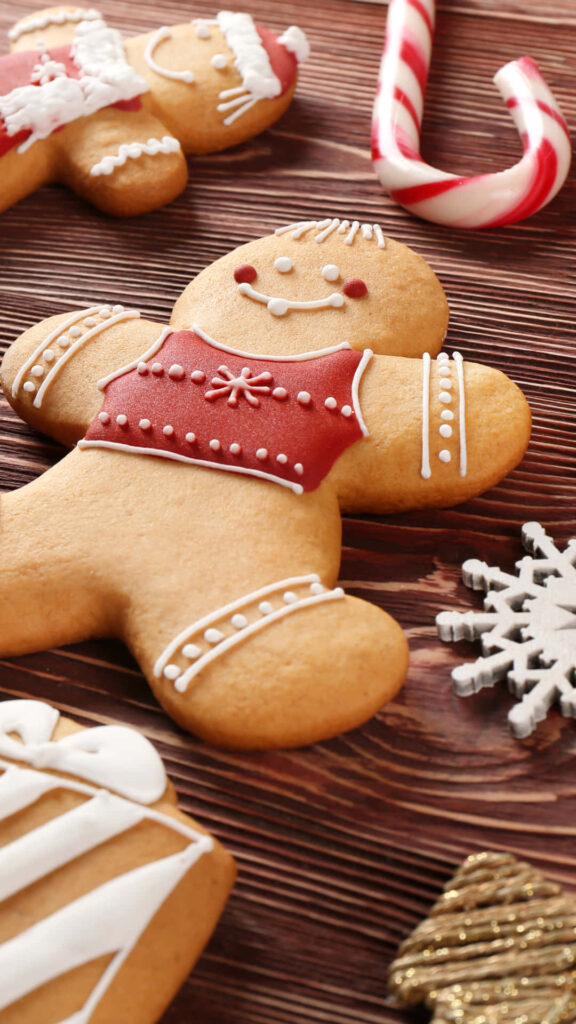 Charming Gingerbread Cookie Wallpaper with Festive Holiday Decor