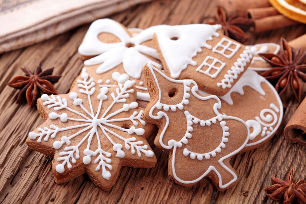 Festive Christmas Gingerbread Cookies Wallpaper with Rustic Background