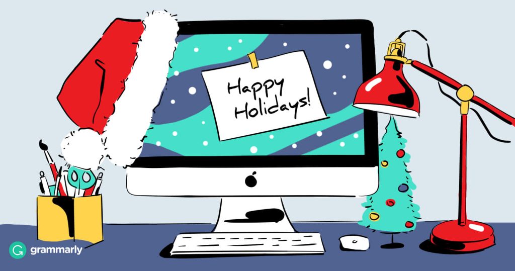 Festive Grammarly holiday wallpaper with Santa hat monitor and cozy Christmas desk setup
