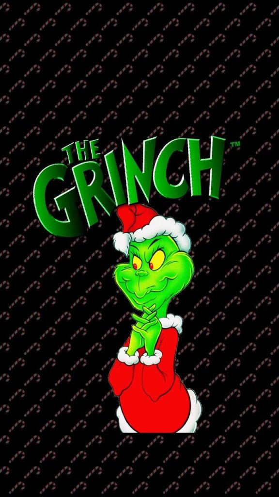 The Grinch in red Santa suit on black candy cane pattern festive Christmas wallpaper background