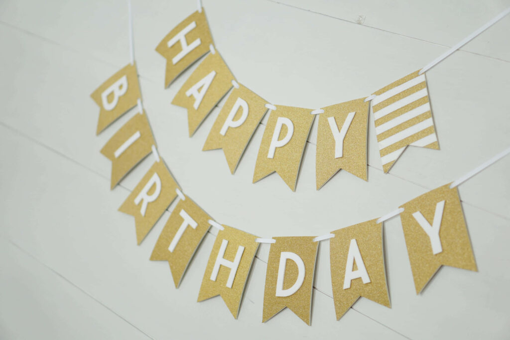 Elegant Gold Glitter Birthday Wallpaper with Festive Banner Design