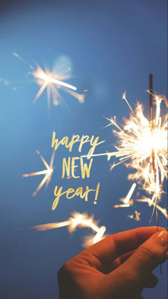 Festive phone wallpaper hand holding sparkling firecracker golden happy new year text blue background