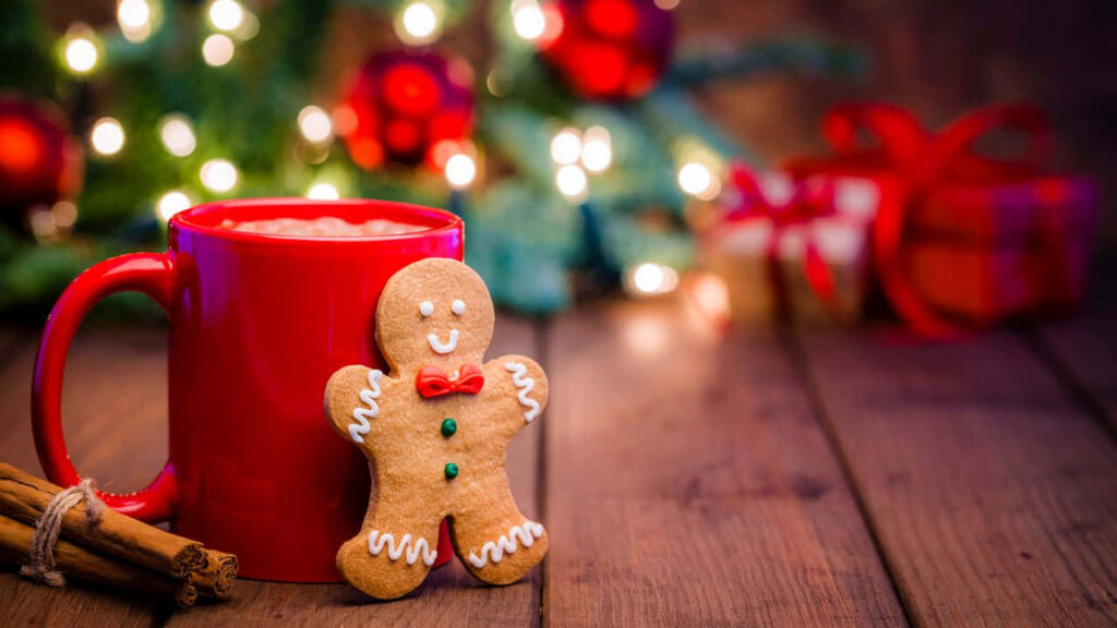 Cozy Holiday Wallpaper: Cheerful Gingerbread Man & Festive Lights