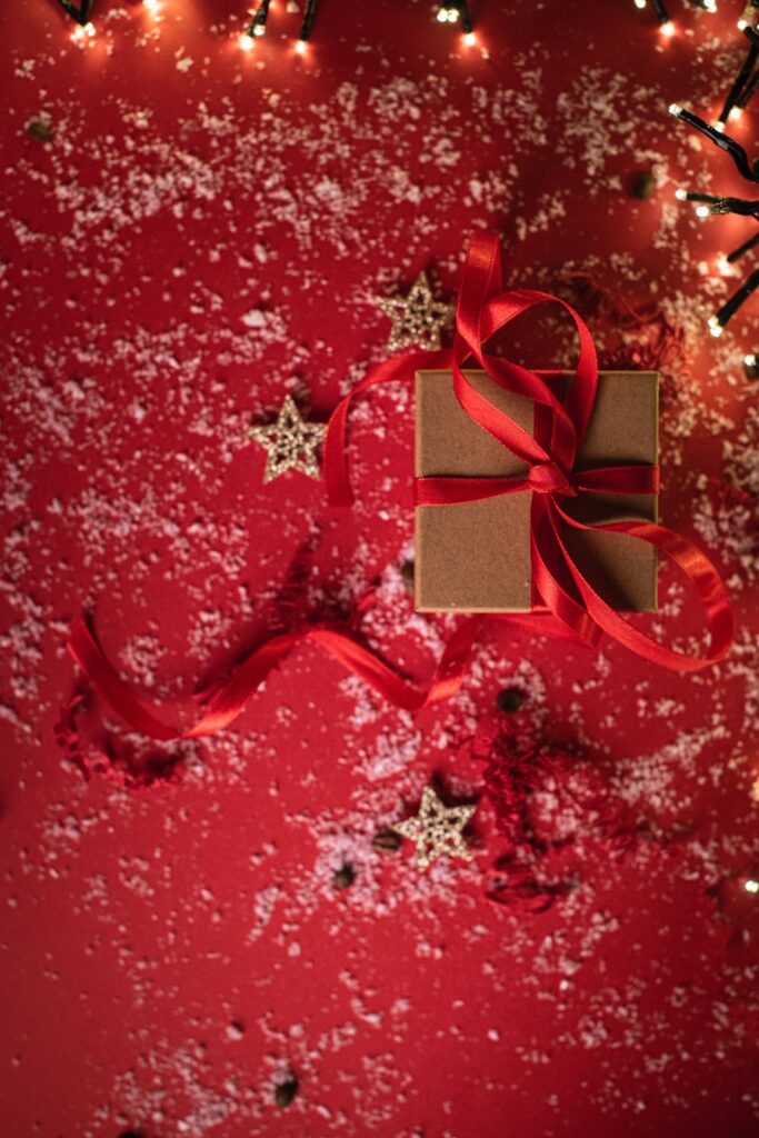Festive Wallpaper: Wrapped Gift Box with Red Ribbon & Holiday Cheer