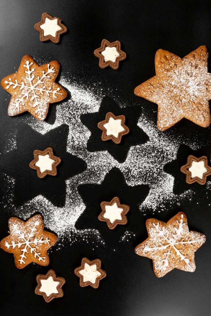 Festive Holiday Wallpaper: Star-Shaped Cookies with Snowflakes