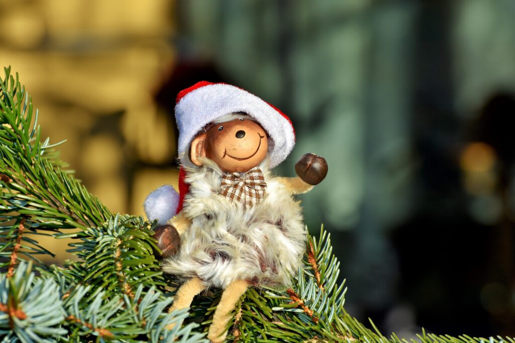 Charming Monkey Toy in Santa Hat – New Year Wallpaper Background