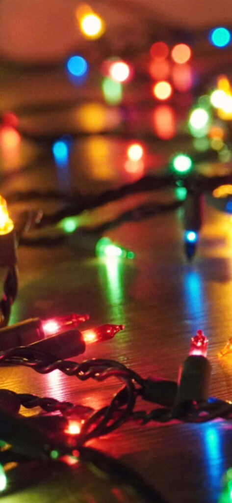 Festive Multicolored Lights Wallpaper for a Cheerful Holiday Background