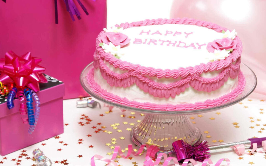 Festive Pink Birthday Cake Wallpaper: Celebratory Party Decorations