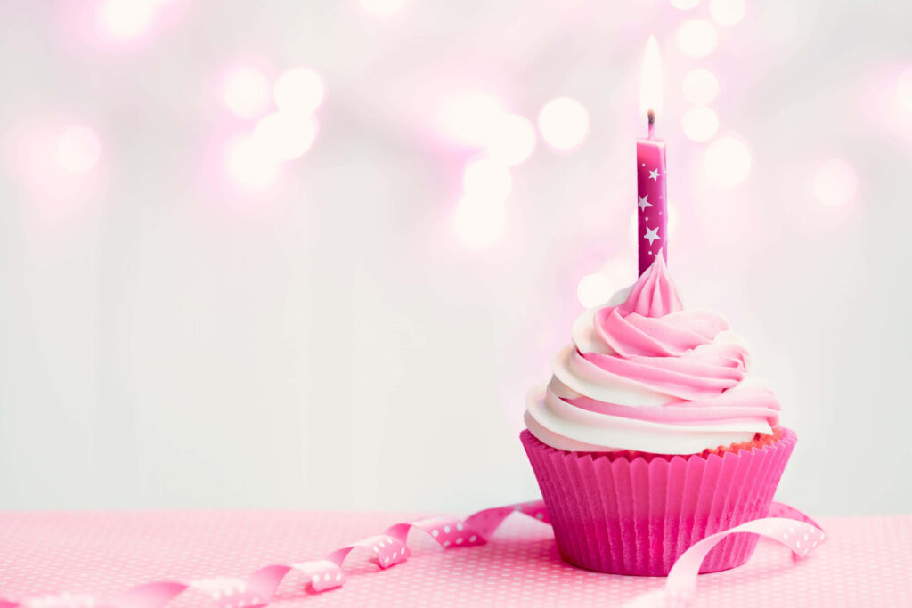 Charming Pink Cupcake Wallpaper with Frosting & Candle - Dreamy Background