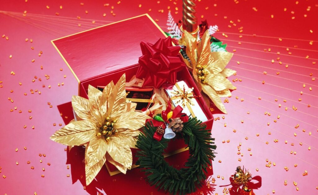 Festive Red Gift Box Wallpaper with Poinsettias & Holiday Cheer