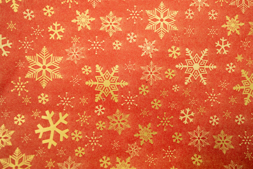 Festive Red Wallpaper with Gold Snowflakes for Holiday Decor