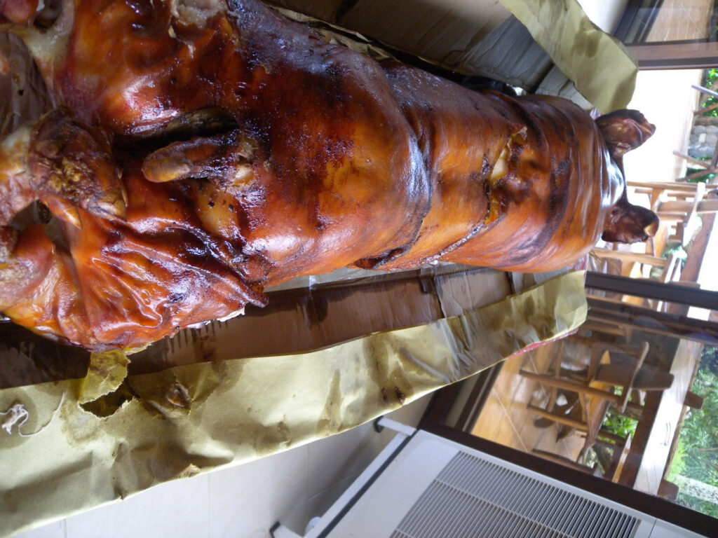 Golden-Brown Roasted Lechon Wallpaper for Festive Gatherings