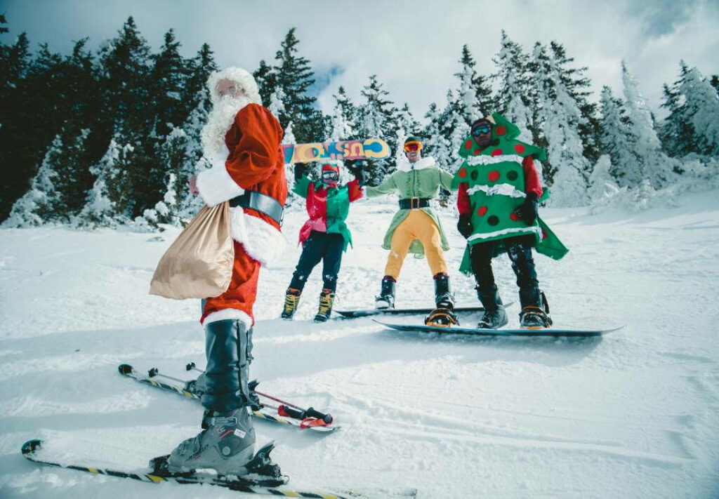 Santa Skiing on Snowy Wallpaper: Festive Holiday Scene